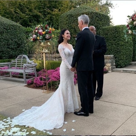 Natalie Solis and Craig Miller exchanging wedding vows with each other at the wedding